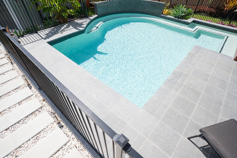 modern pool with gravel pathway